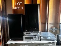 Complete stereo setup showing receiver, cassette deck, turntable and two speakers