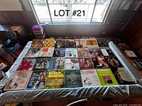 Tabletop view of entire assortment of vinyl records in jackets