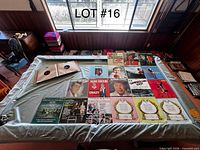 Overview of all records laid out on table, showing LP jackets, 78 RPM sleeves and additional sleeved records