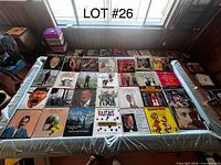 Top view of entire assortment of vinyl records laid out on table