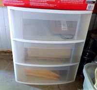 Front view of one wider three-drawer unit showing translucent drawers