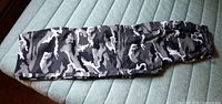 Full view of camo convertible zip-off track pants