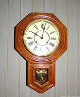 Front view of octagonal regulator wall clock