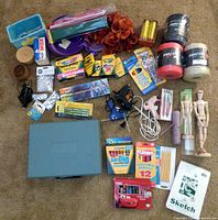 Overview of entire craft lot laid out on carpet