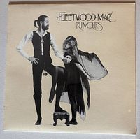 Front cover of sealed Fleetwood Mac Rumours LP showing intact shrink wrap and slight corner wear.