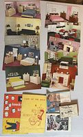 Group of interior clippings, pamphlets and small booklets laid out