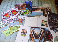 Overview of patches, brochures, toy motorcycle