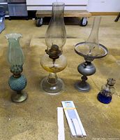 Group shot showing all four oil lamps and wick pack