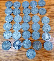 All 35 nickels arranged on wooden surface showing obverse designs
