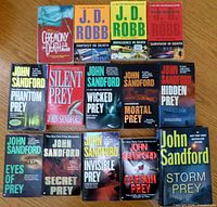 Front covers of all fourteen paperback novels laid out in three rows