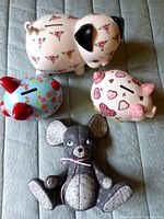 Group shot of four ceramic coin banks