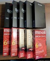 Front view showing five Scotch and five Maxell blank VHS tapes
