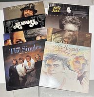 Group shot of all six album covers partially overlapped