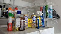 Wide shot of shelf with assorted cleaners showing quantity and variety