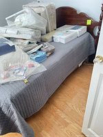 Headboard attached to bed frame showing overall size and color