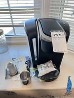 Coffee maker with accessories on countertop