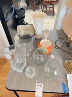 Group shot of all nine vessels on table