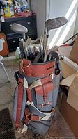 Bag with clubs standing in garage