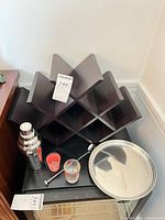 Entire lot showing wine rack, shaker, spoon, shot glasses, tray