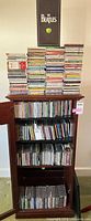 Entire cabinet with CDs in stacks and shelves