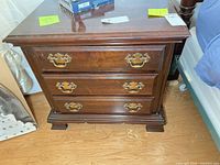 Front view of one nightstand showing drawers and hardware