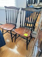 Front view of both Windsor chairs showing two-tone finish