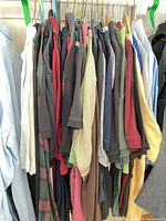 Group of polo shirts on hangers showing colour variety