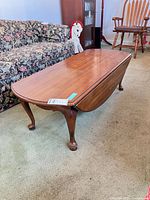 Full view of coffee table with one leaf lowered