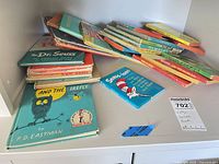 Shelf view showing mixed stack of Dr. Seuss and Beginner Books plus Sam and the Firefly and Seuss-isms