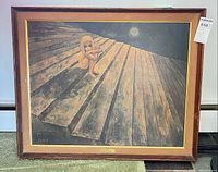 Front view of framed print showing artwork, frame, plaque