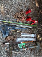 All items laid out: jacks, stand, bender, rods, chains, shackle, copper roll