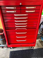 Front view of red Beach 12-drawer tool cabinet on casters