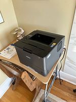 Angle view of Brother HL-L5200DW printer on table