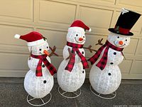 All three wire-frame snowmen showing relative sizes and attire