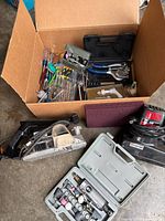 Box with hand tools, die grinder kit, sanding pad and power tool