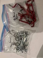 Two bags of assorted pegboard hooks