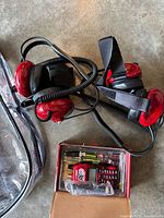 Two red Racing Electronics headsets, coiled cables, RE 300 scanner in box