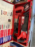 Cordless Milwaukee Sawzall body in red case with manuals and blades