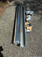 Two 5-ft duct sections with elbows and clamp boxes laid out