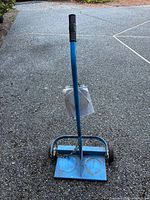 Front view of blue welding tank cart