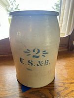 Front view of crock showing blue stenciled 2 E.S.&B. mark and exterior glaze