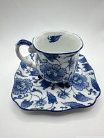 Teacup on saucer showing overall form and pattern