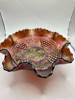 Top view showing ruffled rim and grape & leaves pattern