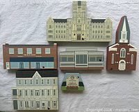 Front view of all six Cat's Meow wooden buildings