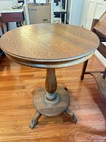 Full view of wooden pedestal table