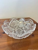 Overall view of cut glass bowl on wood surface