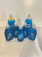 Front view of all seven Dawn Ultra bottles grouped by size