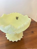 Overall view of yellow milk glass compote on pedestal