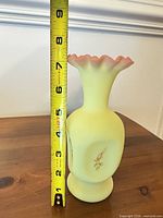 Full view of vase beside measuring tape showing approximately 7 inch height