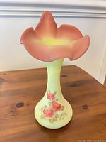 Full view of vase front showing shape and floral painting